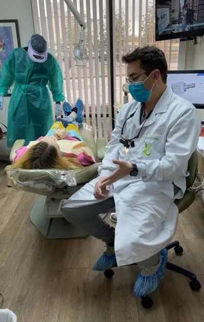 Dr. Oliveira discussing dental veneers with a patient at Lake Lucerne Lifestyle Dentistry in Orlando, FL