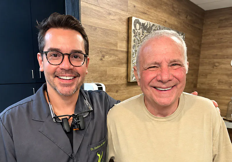 Dr. Oliveira with a dental implant patient at Lake Lucerne Cosmetic and Implant Dentistry