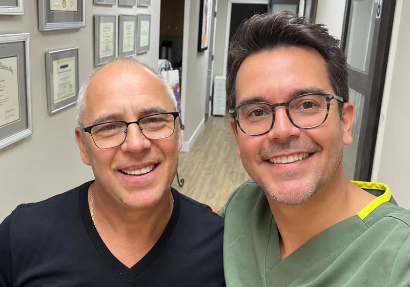 patient smiling with dental veneers from Lake Lucerne Cosmetic and Implant Dentistry